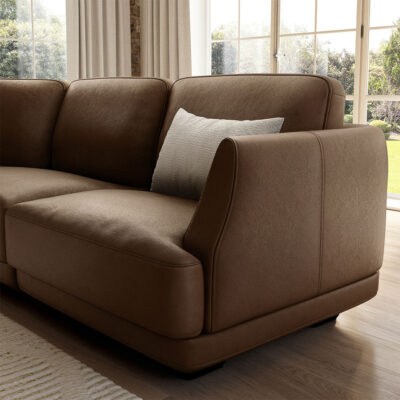 Natuzzi Carter sofa - in a rich dark brown, close up showing details of the arm and side