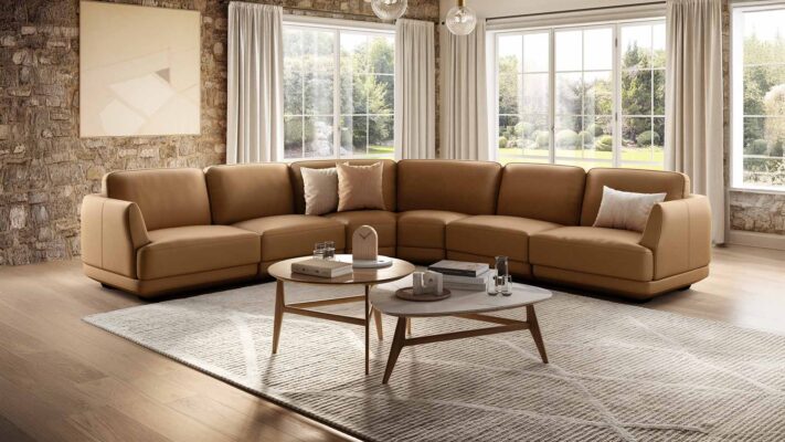 Natuzzi Carter sofa - shown in leather, and large setup in corner of room.