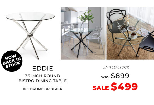 Modern round glass dining table with chrome or black metal legs.